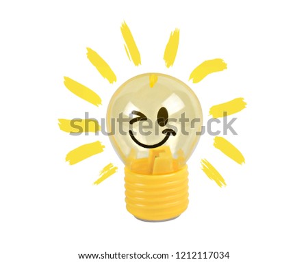 Light bulb or lamp toy yellow emoticons smile isolated on white background with clipping path.Concept Business idea to make money.