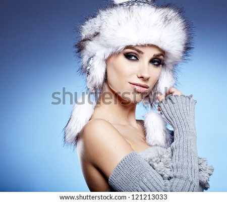 beauty winter girl on the blue  background