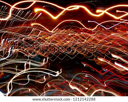 colorful abtract​ lighting background of long exposure traffic jams in the city, night time 