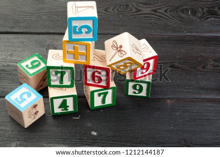 Letters background. Wooden cubes with letters on wooden background
