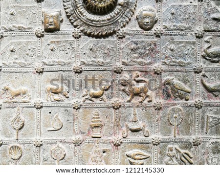 Low Embossed Art on Footprints of buddha. Low relief.