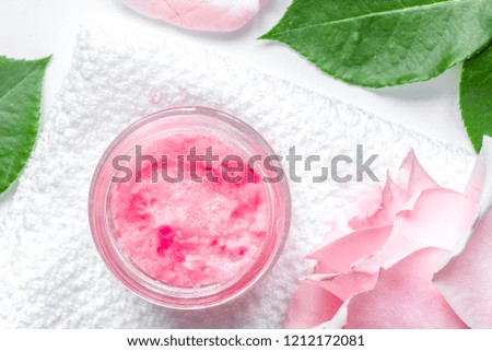 organic cream with rose oil on white background top view