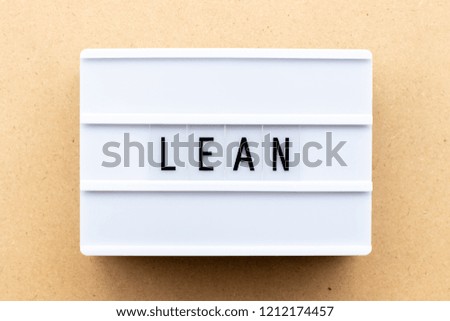 Light box with word lean on wood background