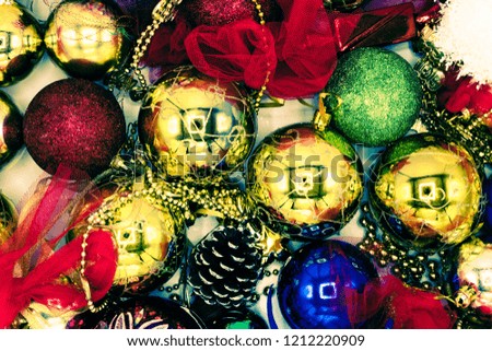 Christmas vibrant colorful wallpaper background texture of balls and decorations for the celebration tree.