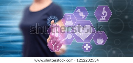 Woman touching a medical technology concept on a touch screen with her finger