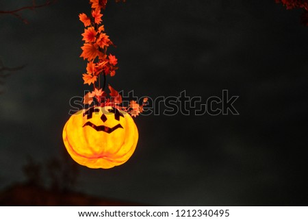 Picture of scary orange halloween pumpkin with angry face.