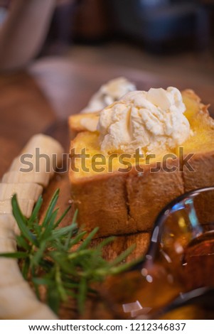 Honey Toast with ice-cream and whipped cream on dish.