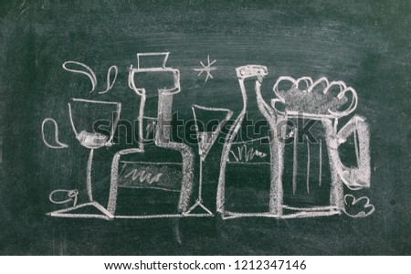 Bottle and glasses symbol, sign on chalkboard, blackboard texture