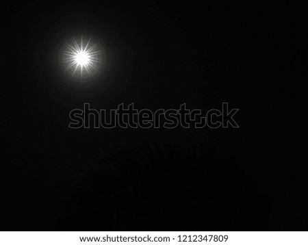 White light in the moon in the sky Black background Dark tone