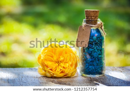 Fragrant salt. Spa concept. bottle of salt and a rose. Organic cosmetic