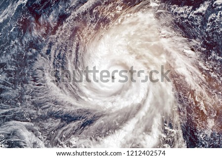 Super Typhoon Yutu, strongest storm on Earth in 2018. Satellite view. Elements of this image furnished by NASA. Royalty-Free Stock Photo #1212402574