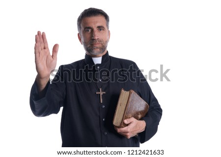 Priest male blessing hand with holy Bible in hand