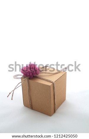 a craft paper gift box, handmade gift concept, isolated on white. recycle gift box.