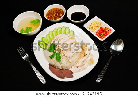 Thai gourmet steamed chicken with rice in black background