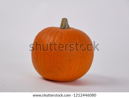 Orange pumpkin on a white background pumpkin in a hat witch pumpkin in glasses and toilet paper.