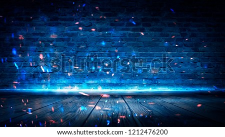 Old brick empty wall, night club background, neon light, rays, sparks, smoke