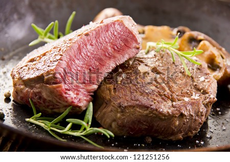 beef steak in the pan Royalty-Free Stock Photo #121251256