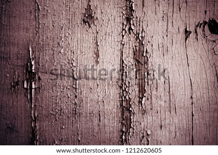 Old plank wooden wall background. The texture of old wood. Weathered piece of wood.