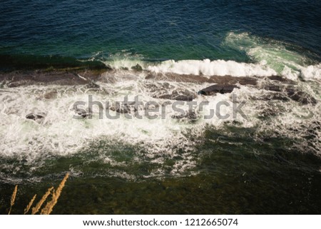 sea waves breaking on submerged reef. real photo from high mountain.