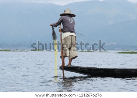 Fishermen are traditionally fishing in Inle, Myanmar.