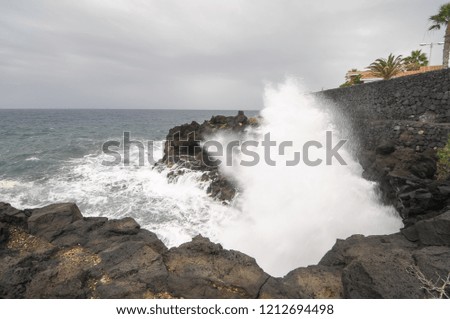 waves crashing on rocks, digital photo picture as a background