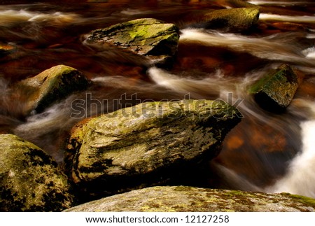 Wild water flow among stones