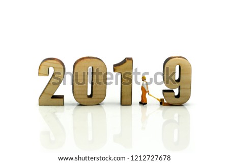 Miniature people : Worker with wooden of number 2019,Happy New Year 2019 concept.