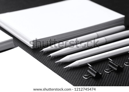 Branding mock up. Blank corporate stationery set on black paper background.