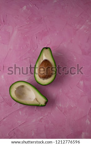 
avocado on a pink background 

