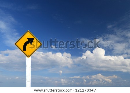 Direction sign- right turn warning on blue sky background with blank for text