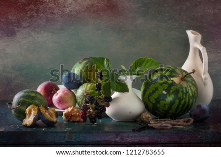 vegetarian autumn still life with fruits and vegetables on a colored background