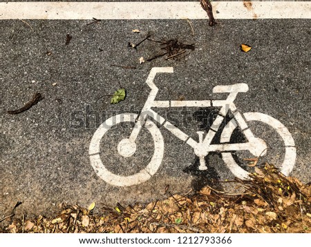 Bicycle symbol on asphalt. Sign of bicycle lane on the road.