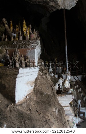 Buddha statues in the lower Pak Ou Cave besides the Mekong river 25km upstream of Luang Prabang	