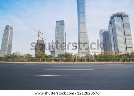 Empty asphalt road and modern urban architecture skyline panorama in Beijing China