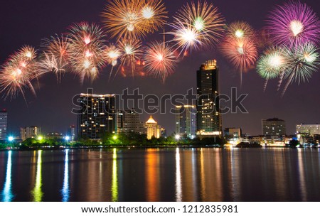 Fireworks with city night in river view background