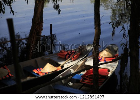 An Giang, Vietnam - October 18th, 2018: Tourism rowing boat in Tra Su flooded indigo plant forest in An Giang, Mekong delta. Tra Su Cajuput Forest is located in Van Giao Commune, Tinh Bien Dist
