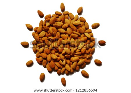 Almond nuts in sunny shape concept on the white background