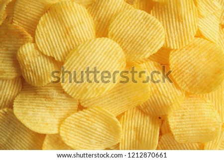 crispy potato chips snack texture background closeup top view