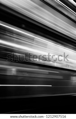 Motion blur abstract - long exposure of passing bus - black and white filter applied