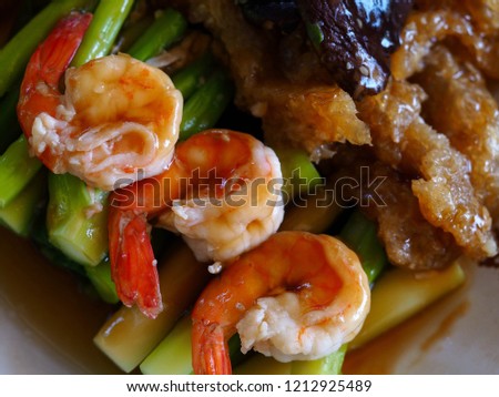 Stir fried Chinese Hong Kong kale, shrimp, fish maw and mushroom in oyster sauce. Chinese food.