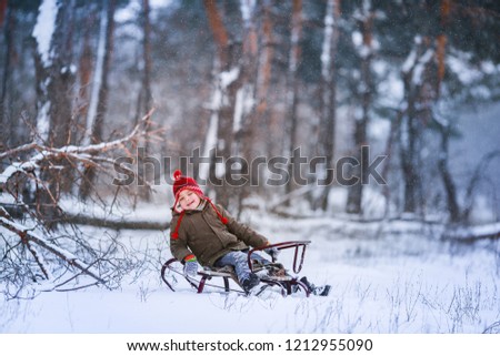 
Preschooler in winter forest