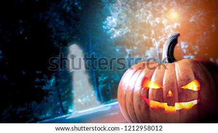 Halloween Pumpkin ang Ghost In A Mystic Forest At Night