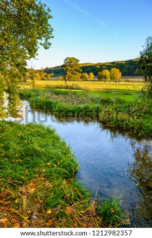 River Chess on an Autumns evening walking in the Chilterns countryside, Buckinghamshire, England. Royalty-Free Stock Photo #1212982357