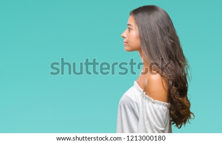 Young beautiful arab woman over isolated background looking to side, relax profile pose with natural face with confident smile.