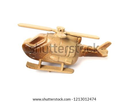 Plastic helicopter toy on white background.