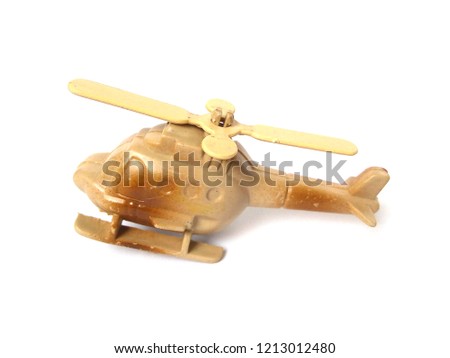 Plastic helicopter toy on white background.