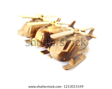 Plastic helicopter toys on white background.