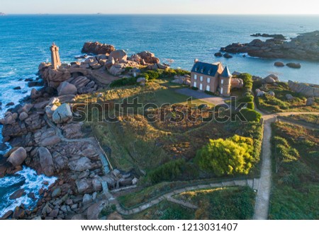 drone photo of cape with lighthouse and house in Bretagne in France