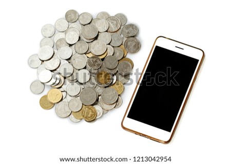 Isolated photo of online banking concept including smartphone and pile of coins.