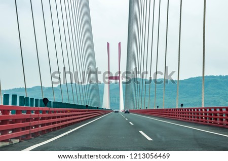 Modern bridge pylon against a blue sky Royalty-Free Stock Photo #1213056469